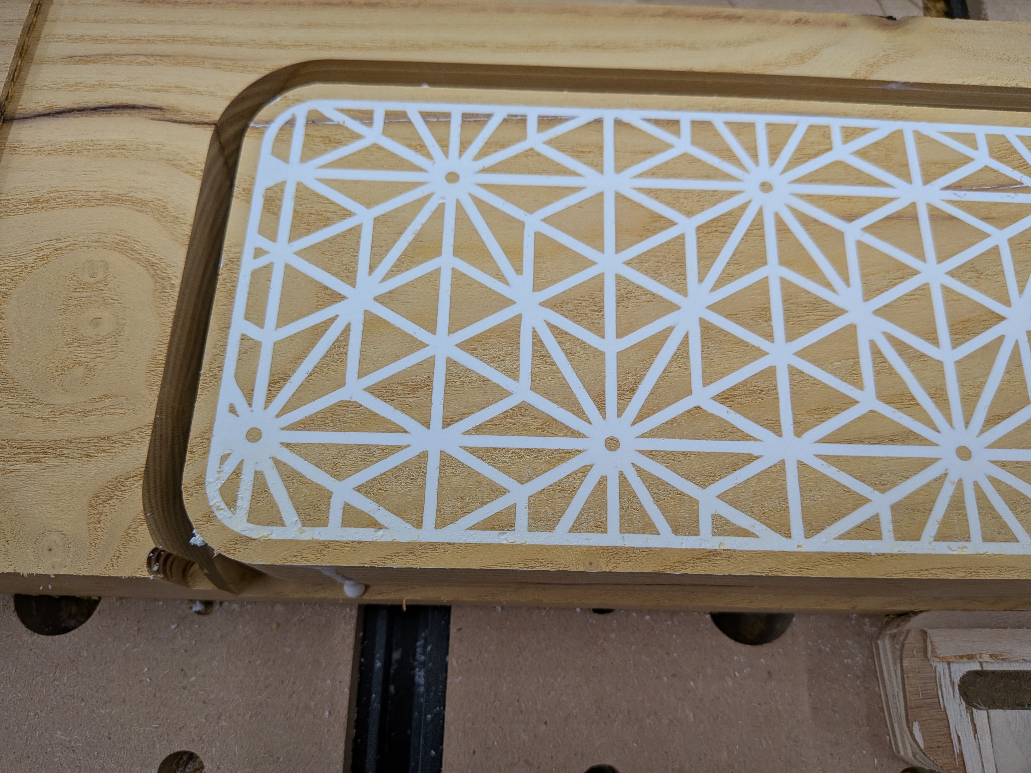 Close-up of the Asanoha pattern on the mulberry cover – white dyed epoxy filling the geometric star pattern flush with the mulberry surface