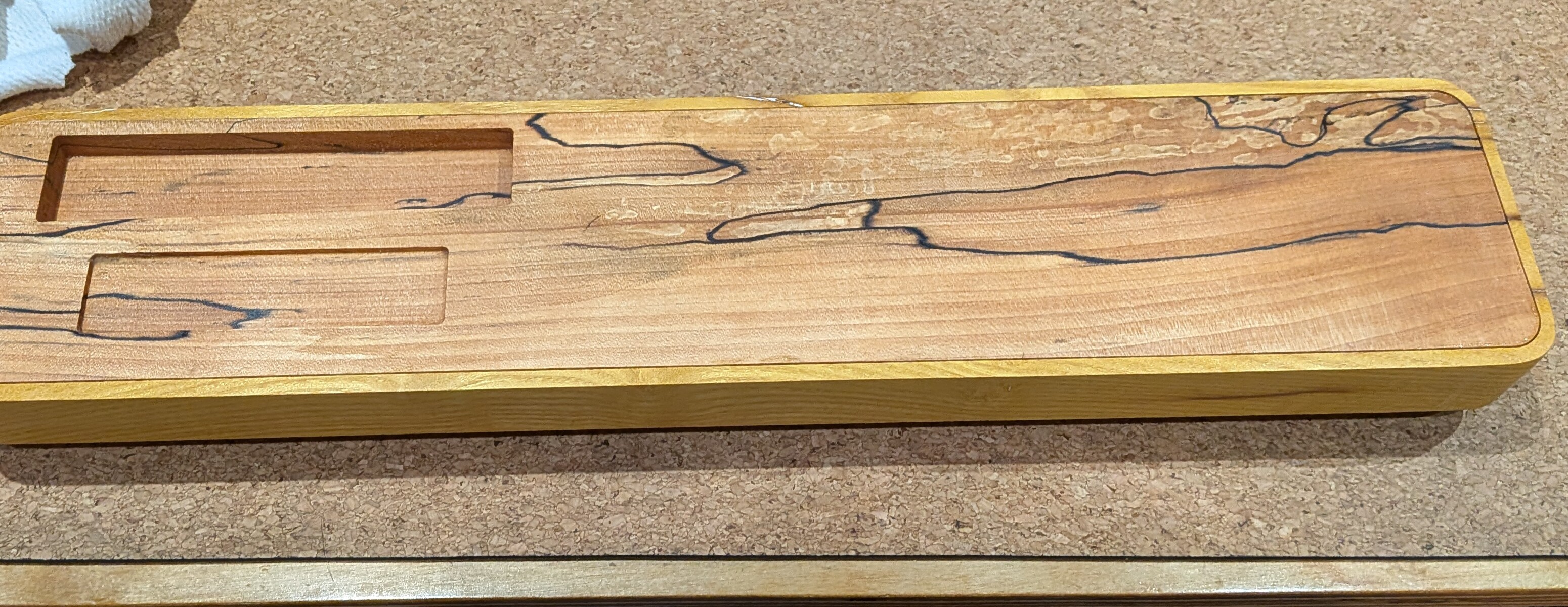 An intermediate version of the bed nested in the upside-down mulberry cover in display mode – this version still has the rectangular brass plate pocket, later replaced with a circular disc